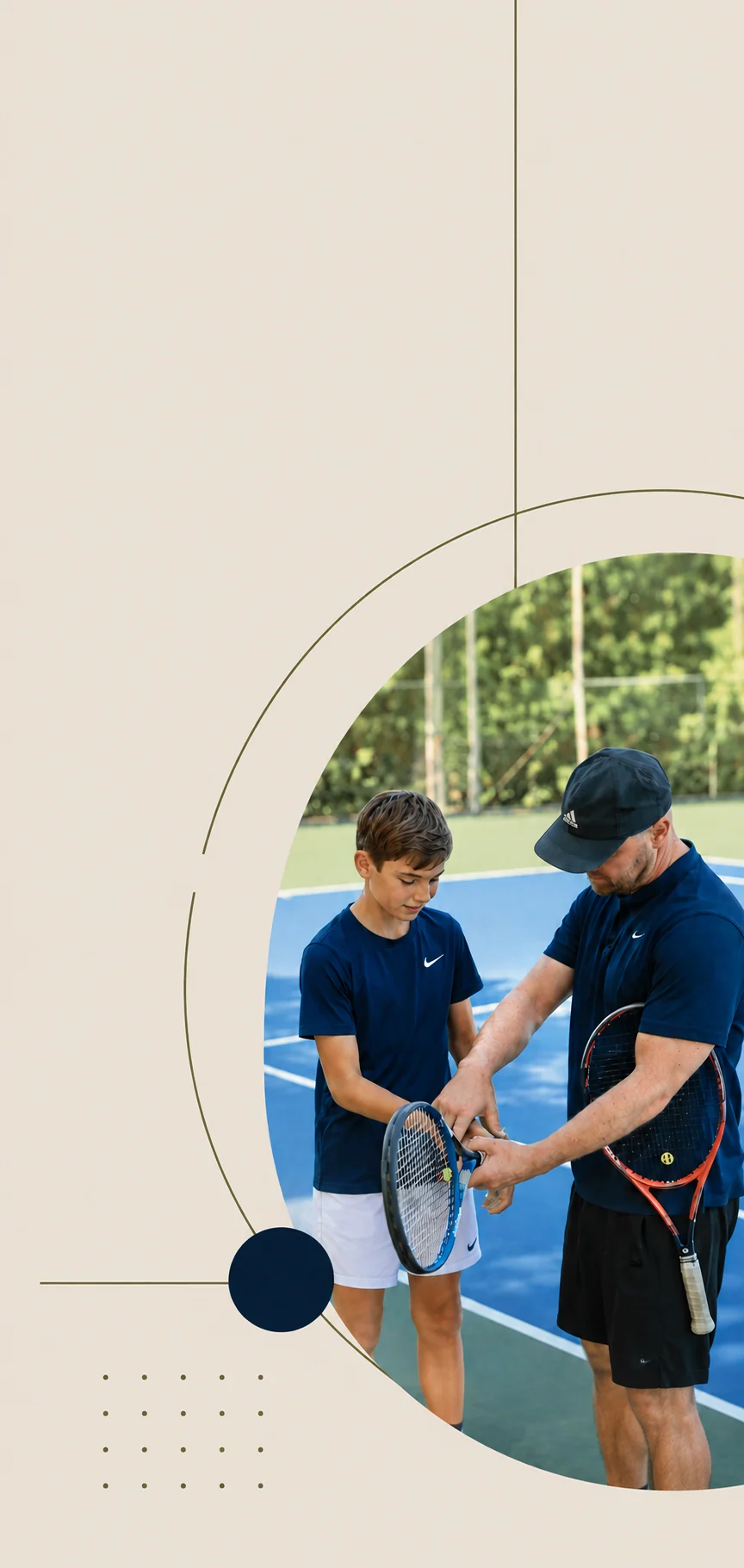 A coach adjusting a young player's grip on the racket handle during a lesson on a blue hard court.